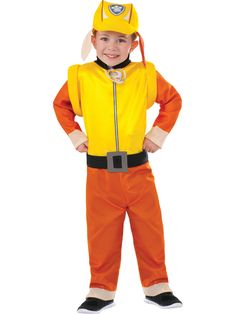 a young boy dressed in an orange and yellow costume standing with his hands on his hips