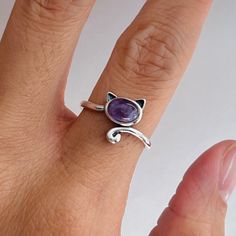 925 sterling silver  Stone: amethyst  Finish: oxidized  Height: 12.1 mm Can be worn: on multiple fingers and midi ring  Symbolizes: power, strength, purity, courage, rebirth, and resurrection Silver Sterling Silver Amethyst Ring Gift, Dainty Amethyst Birthstone Ring In Sterling Silver, Dainty Sterling Silver Amethyst Birthstone Ring, Silver Sterling Amethyst Open Ring, Dainty Silver Amethyst Rings, Dainty Silver Amethyst Ring Gift, Silver Amethyst Stackable Rings As Gift, Purple Sterling Silver Stackable Rings For Gift, Adjustable Sterling Silver Amethyst Ring Gift