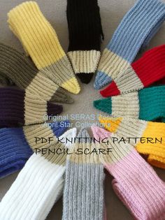 many different colored knitted gloves arranged in a circle