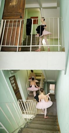 two women in pink dresses are walking up the stairs to their rooms and one is carrying a white bag