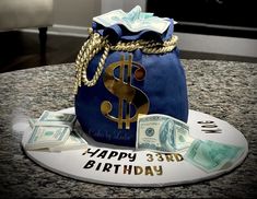 a birthday cake made to look like a purse with dollar bills on the counter top