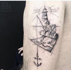 a man's arm with a lighthouse and an anchor tattoo on the left thigh