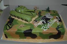 a camouflage birthday cake with a tank on it