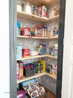 the pantry is stocked with many different types of food and drinks, including cereals