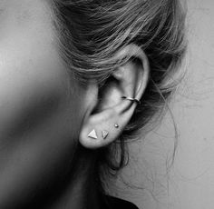 a woman with ear piercings on her ears