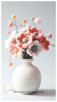 a crocheted vase with flowers in it