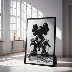 a black and white photo of a mickey mouse with money on the ground in front of it