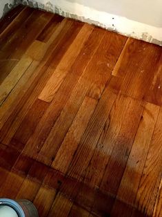 a wooden floor that has been stripped off