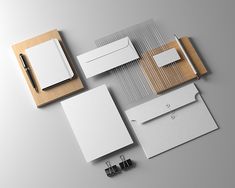 an assortment of stationery items including envelopes, notepads, and pen