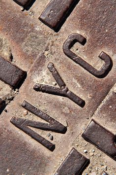 an old rusty metal plate with the word fix written on it