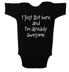 a black baby bodysuit that says i just got here and i'm already awesome