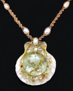 "This pendant is a real seashell that's been filled with genuine mother of pearl, abalone, and a small sand dollar that's been sealed under glass. The necklace is hand braided hemp with freshwater that is adjustable, when fully closed it measures 18\" ... when fully open it measures 24\" in length making it easy to slip over one's head." Shell Jewelry With Pearl Pendant, Ocean-inspired Abalone Shell Gift, Handmade Ocean-inspired Pearl Necklace As Gift, Handmade Ocean-inspired Pearl Necklace For Gifts, Handmade Ocean-inspired Pearl Necklace For Gift, Pearl Pendant Shell Gift, Adjustable Shell Necklace With Pearl Charm, Shell-shaped Mother Of Pearl Necklace With Pearl Pendant, Pearl Shell Jewelry For Jewelry Making