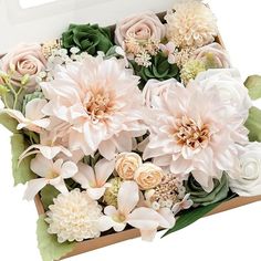 a box filled with lots of pink and white flowers