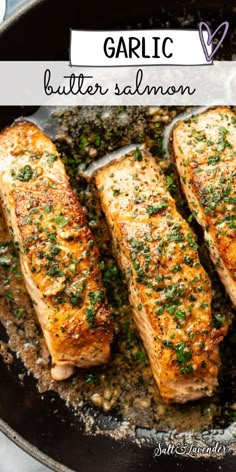 grilled salmon fillets in a skillet with garlic