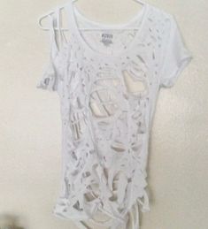 Trendy Ripped T-shirt For Summer, White Short Sleeve Grunge Crop Top, Edgy White Cotton Crop Top, White Grunge Crop Top For Spring, Trendy Ripped Cotton T-shirt, Ripped Grunge Tops For Summer, Trendy Distressed Cotton Crop Top, Grunge Ripped Tops For Summer, Trendy Distressed Tops For Festivals