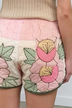 the back of a woman's shorts with flowers on it