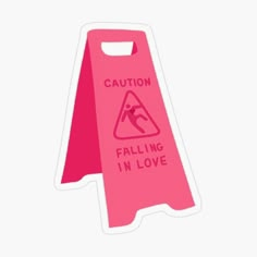 a pink caution sign with the words falling in love written on it and an arrow pointing up