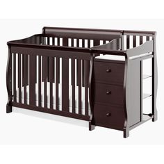 a baby crib with two drawers and a changing table in the bottom drawer area