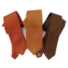 Copper, rust or brown hopsack linen necktie. These are rich in color and varying degrees of earthy tones. The manufacturer named the copper terra, the rust is called kenya, and the potting soil was just that. All with earth terms. As always, we suggest ordering a swatch if you are trying to make a match. Hopsack linen neckties, resembling burlap they are not soft and shiny, rather coarse and without sheen, loosely woven with raised threads, sometimes a slub or pill here and there, this linen nec Tan And Rust Groomsmen, Rust Color Wedding, Rust Orange Tie Wedding, Copper Ties Groomsmen, Terracotta Tie, Rust Tie, Earth Tone Wedding Theme, Rust Floral Tie, Copper Wedding Theme