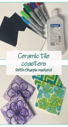 ceramic tile coasters with sharpie markers and crafting supplies on a white table