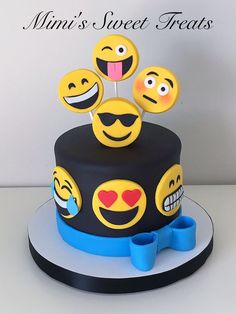 there is a cake decorated with smiley faces