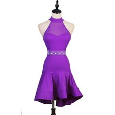 a purple dress on a mannequin stand