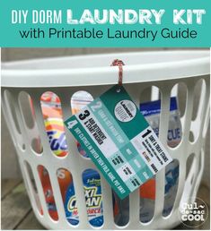 the laundry kit with printable laundry guide is sitting in a white laundry hamper