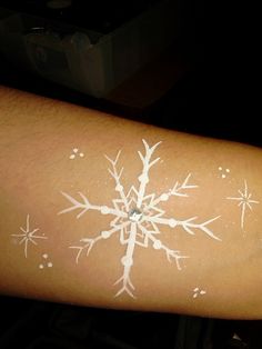 Snowflake | Flickr - Photo Sharing! Snowflake Tattoos, Frozen Face Paint, Painting Snowflakes, Snowflake Tattoo, Adult Face Painting, Christmas Face Painting, Frozen Face, Snow Flake Tattoo, Cheek Art