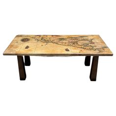 a wooden table with a map on it