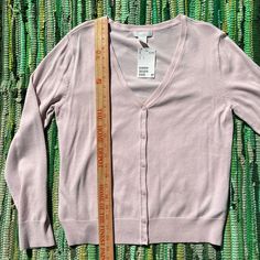 70% Rayon/ 30% Nylon. Color Is A Dusty Light Pink (Ballet Pink). H&m V-neck Sweater For Spring, Fitted H&m Winter Cardigan, H&m Fitted V-neck Sweater, H&m Pink Spring Outerwear, H&m Fitted Spring Sweater, Pink H&m Outerwear For Spring, H&m Fitted Sweater For Spring, H&m Pink Outerwear For Spring, Fitted H&m Sweater For Spring