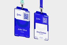 two blue and white id cards with lanyards attached to each one's sides