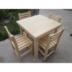 the table and chairs are made out of plywood planks, with no one around them