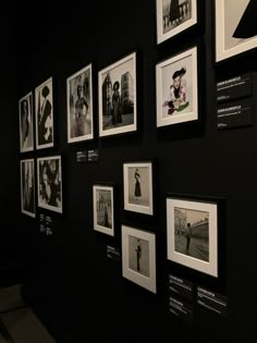 black and white photographs hanging on the wall in a room with people's photos