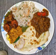 a white plate topped with different types of food