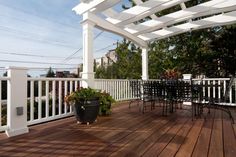 a deck with chairs and tables on it