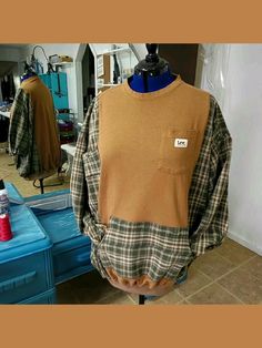 a mannequin wearing a plaid shirt with a patch on the front and back