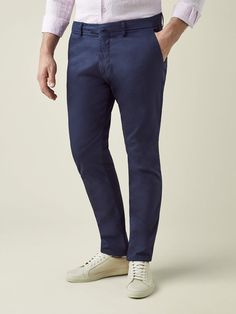 Elevate your spring-summer wardrobe with our cotton chinos, crafted in Northern Italy from lightweight and durable whipcord cotton. This breathable fabric is blended with 3% elastane for added stretch ensuring a more comfortable and easier fit.    Our chinos feature a mid-rise and slightly tapered fit, designed to provide a refined and sophisticated look. With a focus on practicality, this piece is tailored with four convenient pockets and bespoke details such as a concealed triple button closur Polo Design, Sneakers Looks, Cotton Chinos, Chino Trousers, Northern Italy, Mens Casual, Mens Casual Outfits, White Sneakers, Smart Casual