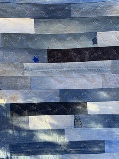 an abstract piece of blue and grey fabric