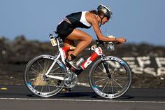 a person riding a bike on a road