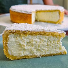 two pieces of cake sitting on top of a plate next to each other, with one slice missing