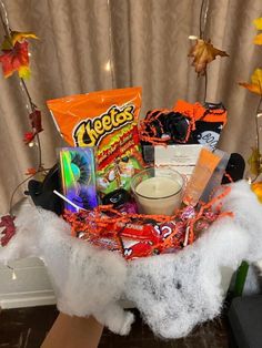 a basket filled with candy and halloween treats