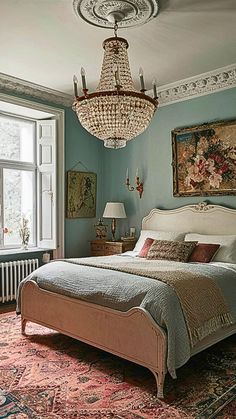 a bedroom with a chandelier hanging from the ceiling and a large bed in front of a window