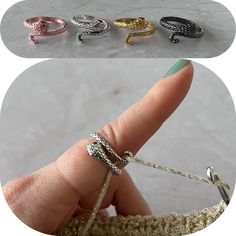 three different types of rings sitting on top of each other in front of a person's finger