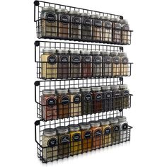 three tiered spice rack with jars and spices on the bottom shelf in black metal