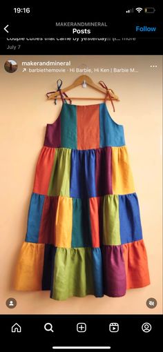 a colorful dress hanging on a wall