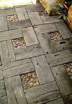 a wooden walkway with rocks and gravel on it