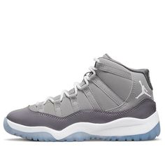 The Air Jordan 11 Retro PS ‘Cool Grey’ is a scaled-down edition made for little kids, faithful to the original 2001 release. It features a grey nubuck upper with tonal webbing lace loops and a glossy patent leather overlay. Branding hits include a Jumpman logo embroidered on the lateral ankle and ‘23’ stamped on the back tab. The lightweight tooling comprises a white Phylon midsole and translucent rubber outsole. (SNKR/AJ11/High Top/Basketball) Jordan 11 Cool Grey, Grey Jordans, Jumpman Logo, Air Jordan 11 Retro, Jordan 11 Retro, Air Jordan 11, Grey Sneakers, Jordan 11, Urban Chic