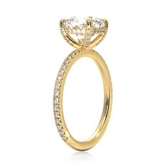 a yellow gold engagement ring with diamonds on it