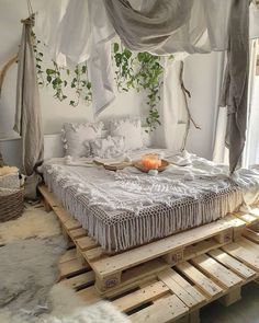 a bed made out of wooden pallets in a room