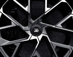 a close up of a wheel on a black and white background with the letter b